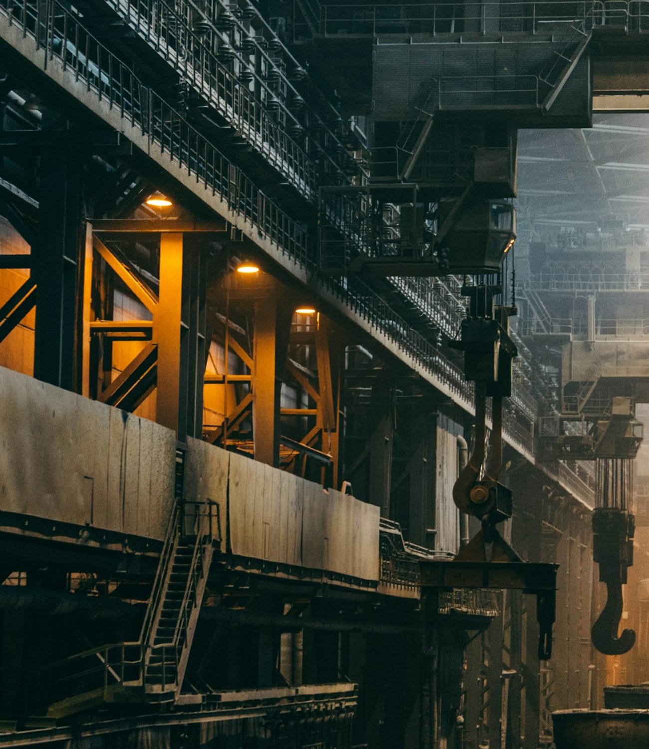 Interior of a metal manufacturing plant with overhead crane and machinery